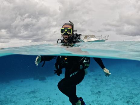 James Barrett scuba diving in the clear blue sea