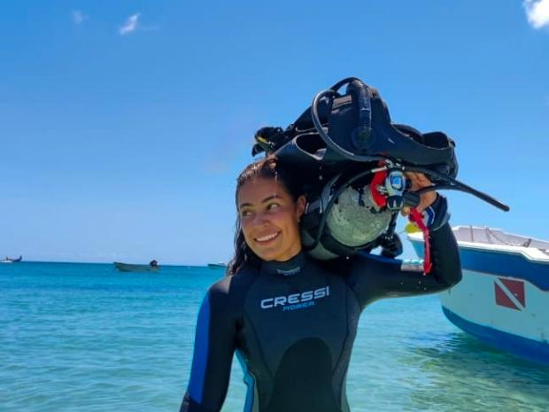 PADI AmbassaDiver Karol Yela in her wet suit.