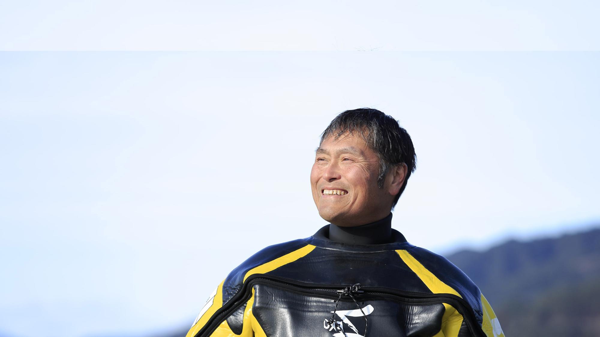 PADI AmbassaDiver Hiroshi Sato in his wet suit.