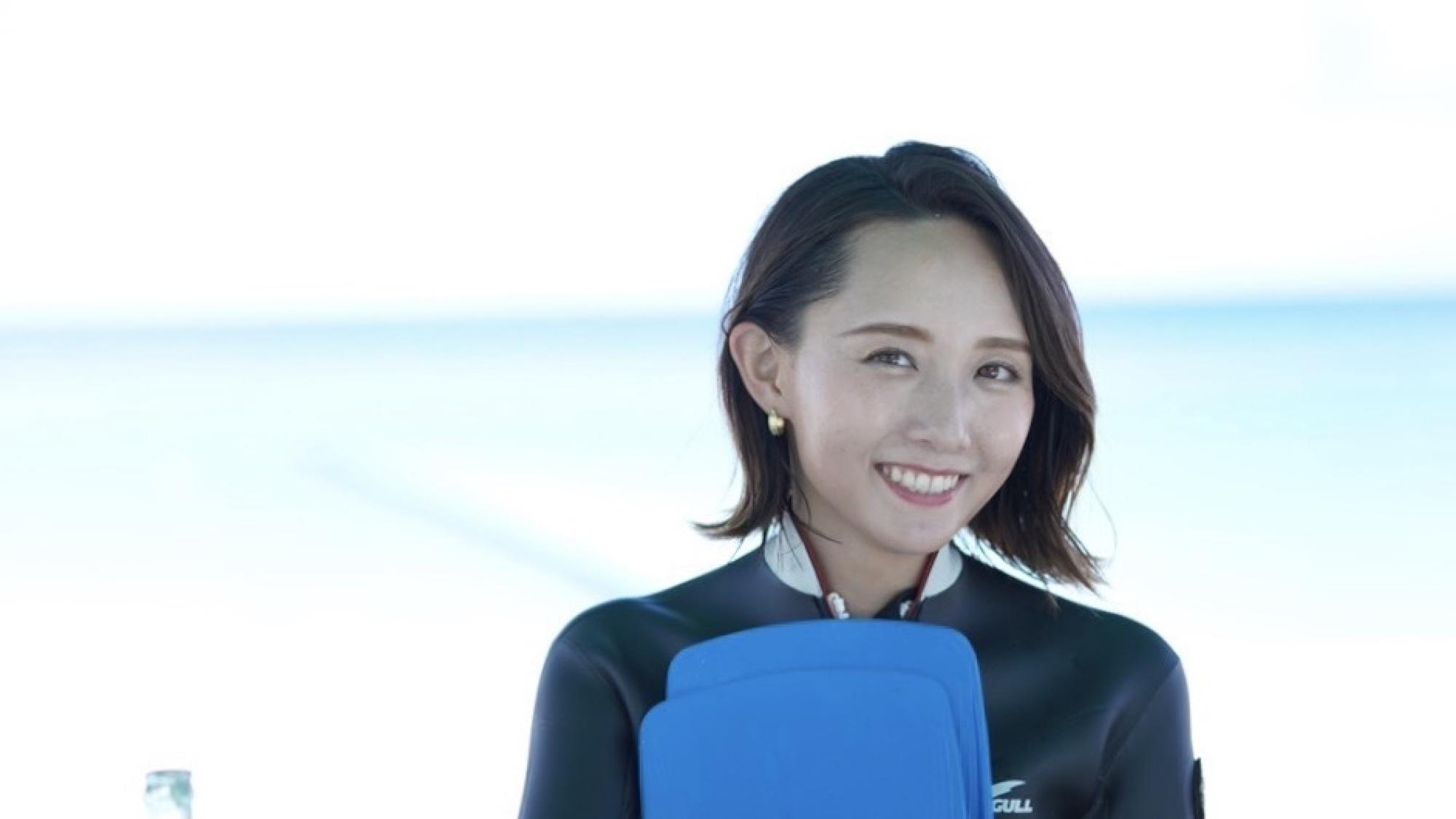 PADI AmbassaDiver Manami Azuma in her wet suit.