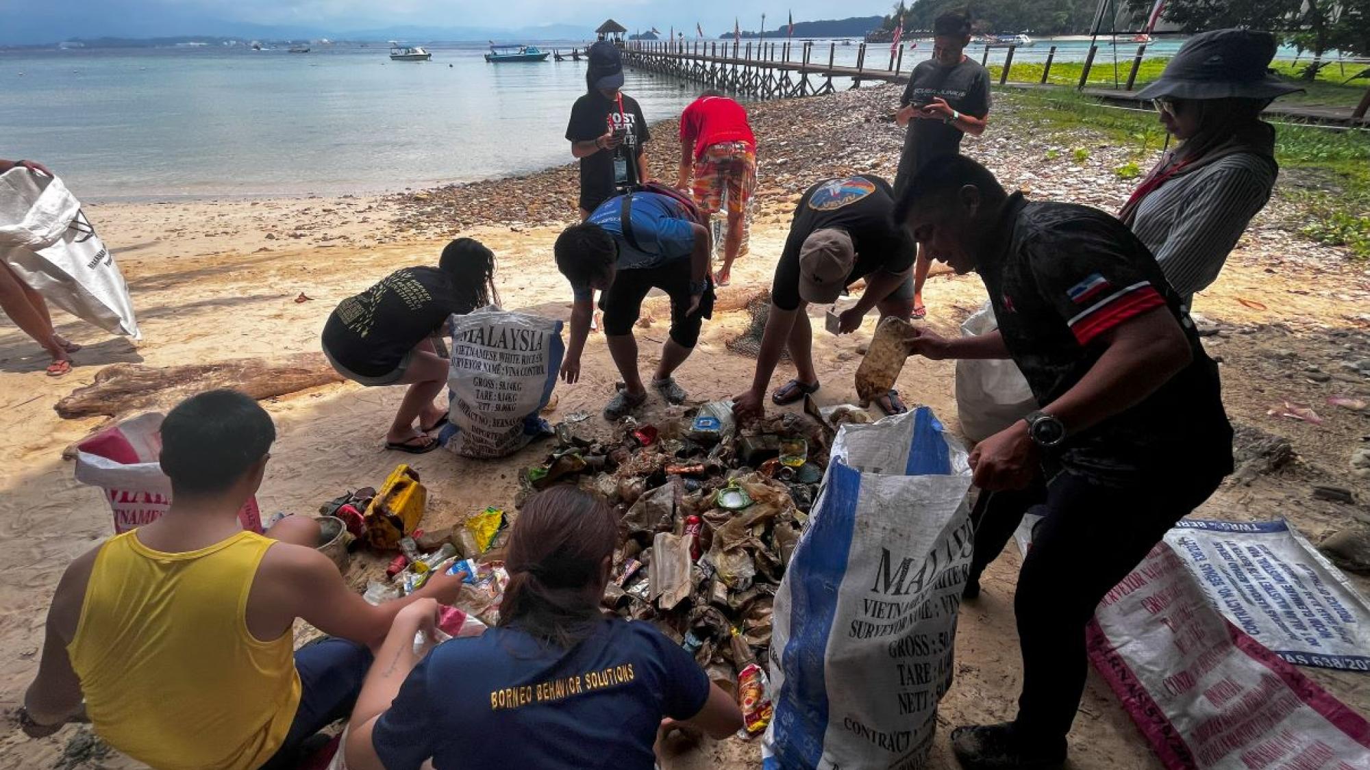 Volunteers segregating trash for data collection